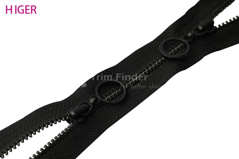 two-way zipper with dual circular pullers on black tape, HIGER logo in magenta.